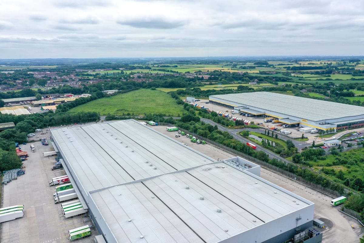 Aerial view of warehouses in G-Park Skelmersdale, surrounded by countryside.