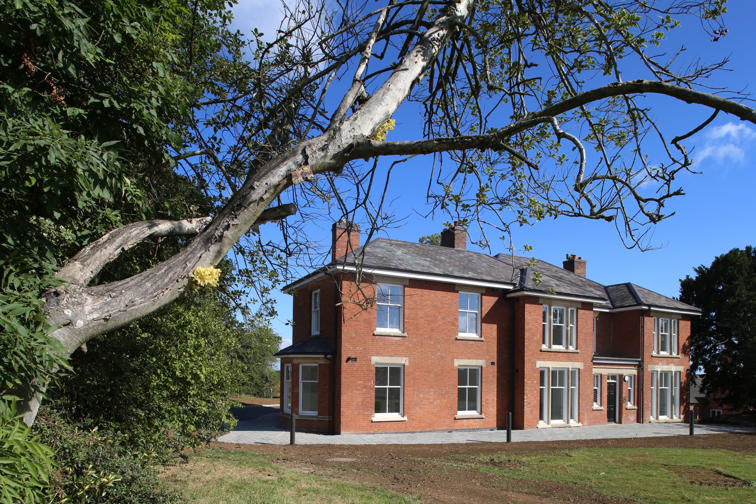 The Centre for Logistics, Education and Research, a red-brick building in a field surrounded by trees.