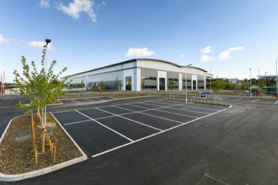 Exterior of Castlewood Business Park showing the warehouse and an empty car park