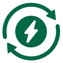 Flowers in a field next to a large warehouse